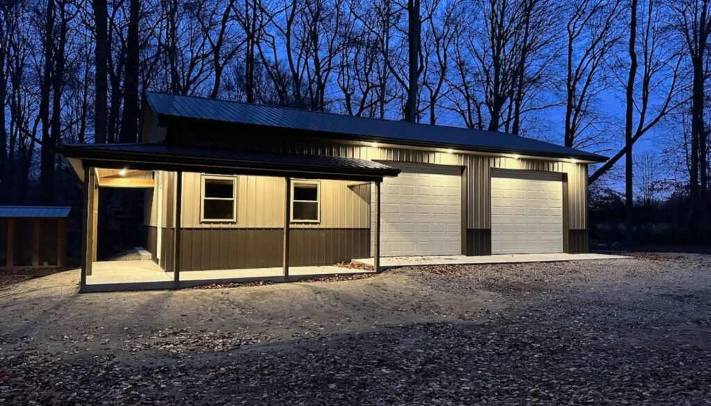 Nighttime photo of a residential two-car garage workshop with a lean-to by Titan Buildings, Delaware.